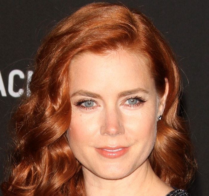 Amy Adams looks radiant with her signature red waves and bright blue eyes