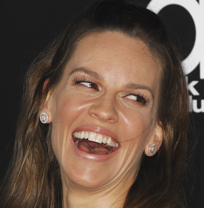 Hilary Swank radiates joy while laughing on the red carpet at the 2014 Hollywood Film Awards