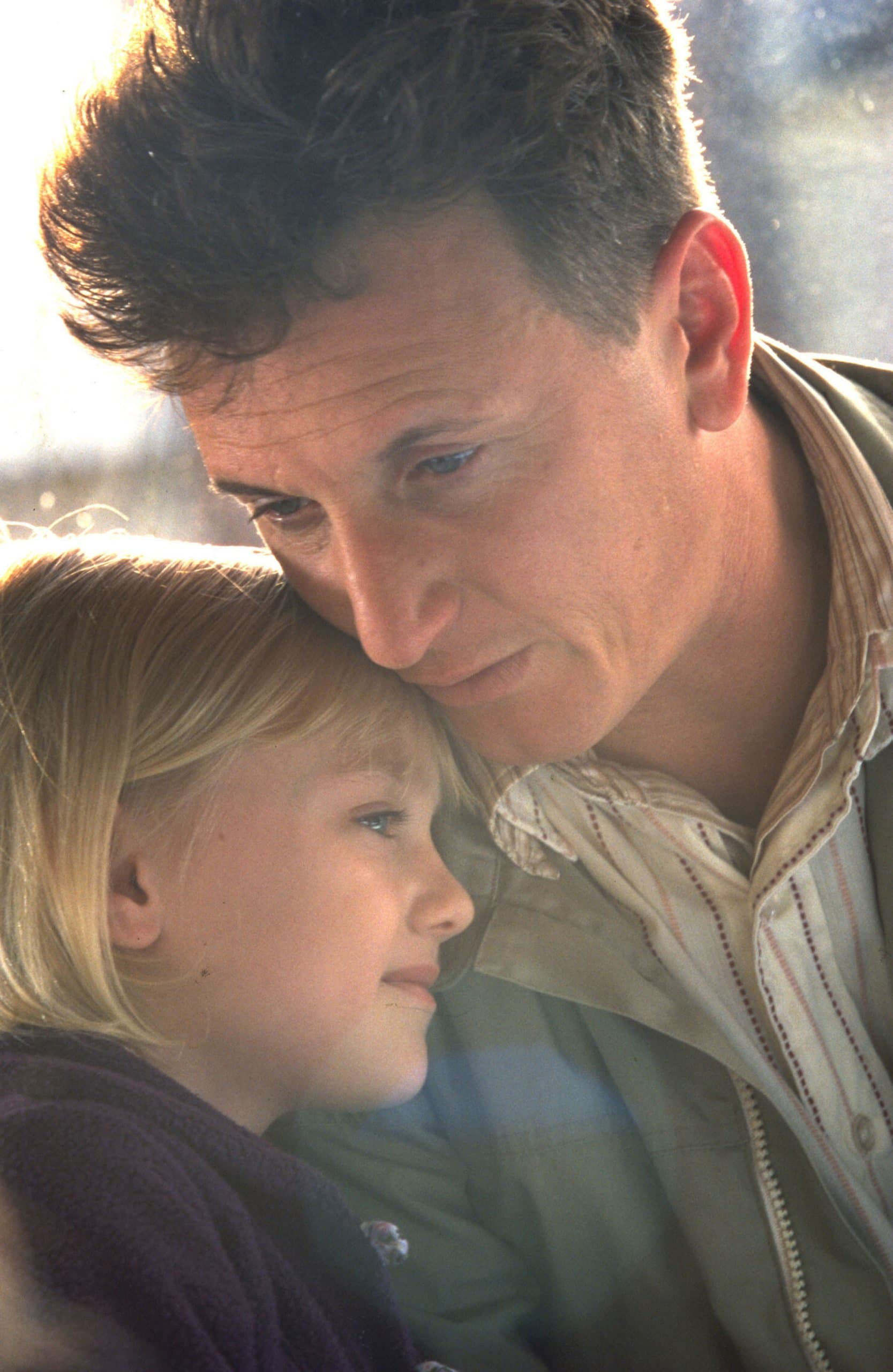 Dakota Fanning and Sean Penn share a touching moment as father and daughter in the emotional drama I Am Sam