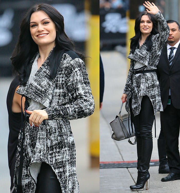 Jessie J waves to fans while looking chic in a textured belted coat, leather leggings, and sleek platform boots