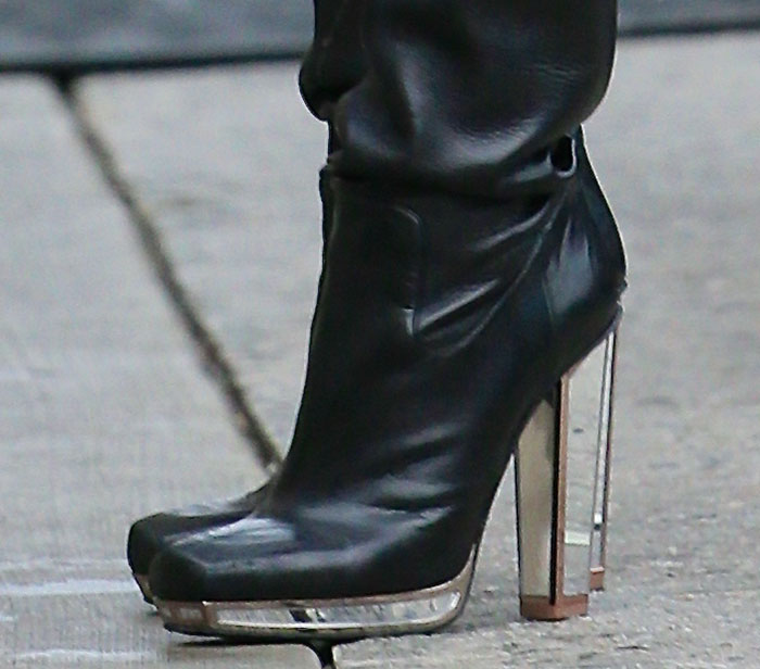 Jessie J steps out in striking Yves Saint Laurent Fall 2012 boots, featuring mirrored 5-inch heels and bold 4.5-inch platforms with copper framing