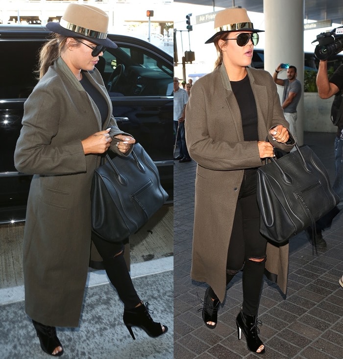 Khloé Kardashian’s ripped black Frame Denim jeans reveal her open-toe Off-White c/o Virgil Abloh booties beneath a long Haider Ackermann coat at LAX
