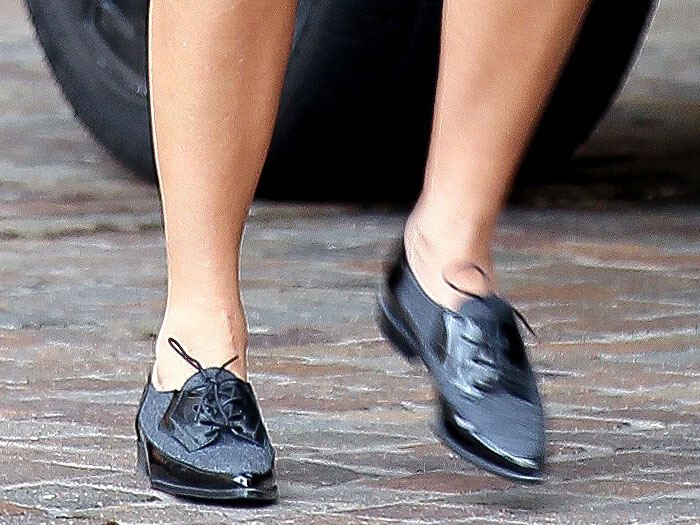 Close-up of Kourtney Kardashian’s Stuart Weitzman “Leman” flannel-and-patent leather oxfords, combining comfort and polish for her chic maternity look
