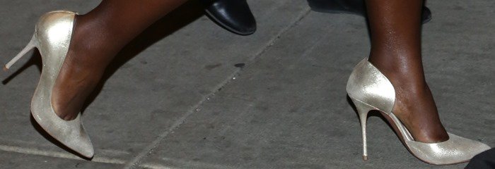 Close-up of Lupita Nyong’o’s metallic Kurt Geiger “Anja” pumps featuring a pointed toe, half d’Orsay cut, and slim stiletto heel