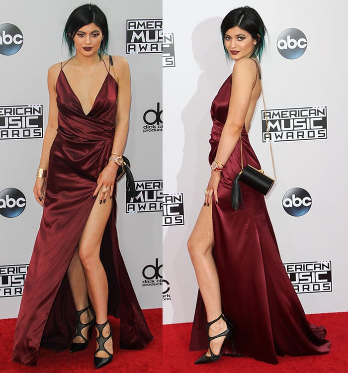 Kylie Jenner paired an oxblood satin Alexandre Vauthier Spring 2014 gown with Tamara Mellon "Fever" fishnet pumps, using the graphic pointed-toe heels to add a modern edge to the gown's fluid draping and thigh-high slit