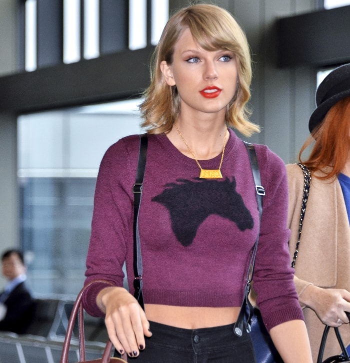 Taylor Swift flaunting her toned midriff in a merino wool "Steel" cropped sweater by Sunday Best