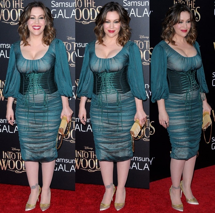 Alyssa Milano donned a dark green ruched chiffon dress from the Dolce Gabbana Fall 2014 collection
