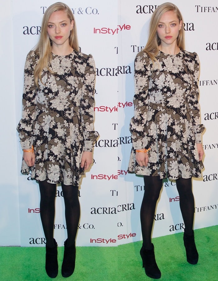 Amanda Seyfried styled a romantic Saint Laurent floral dress with black opaque tights and sleek suede ankle booties, effortlessly blending spring prints with winter-ready accessories