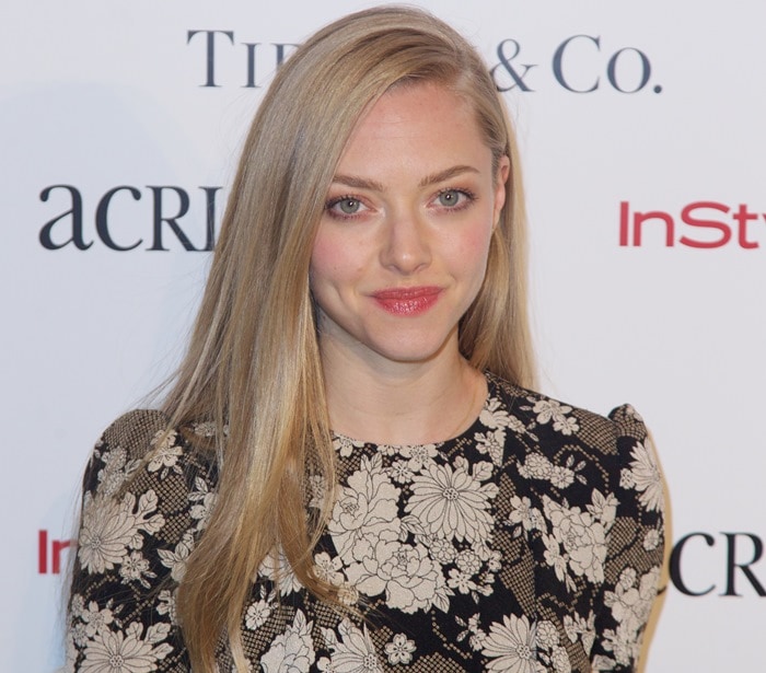 Amanda Seyfried wore her long, straight blonde hair in a sleek side part while attending the 2014 ACRIA Holiday Dinner