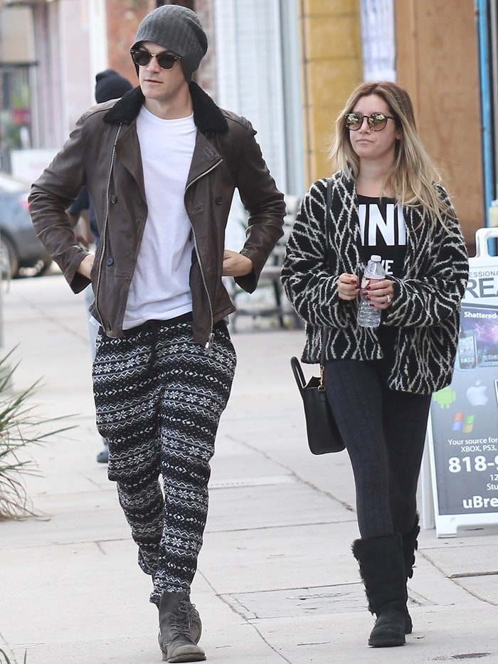 Ashley Tisdale and husband Christopher French coordinate stylish black-and-white outfits, with Ashley rocking UGG "Bailey Button Triplet" boots, while out in Studio City on December 14, 2014