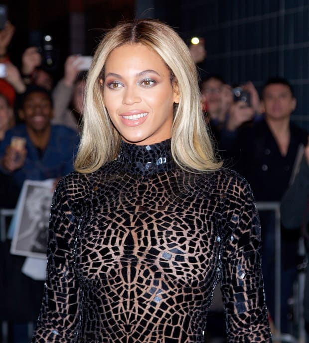 Beyoncé styled her intricate Tom Ford mosaic-effect mini dress with subtle makeup, allowing the dress to be the focal point of her look, while her sleek, straight blonde hair added a touch of elegance
