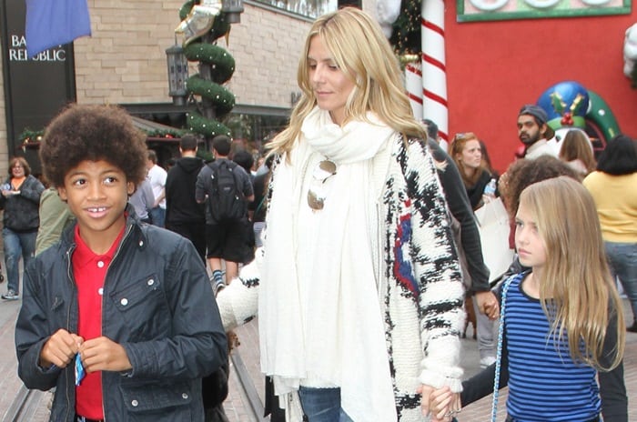 Heidi Klum is accompanied by her son Henry and daughter Leni