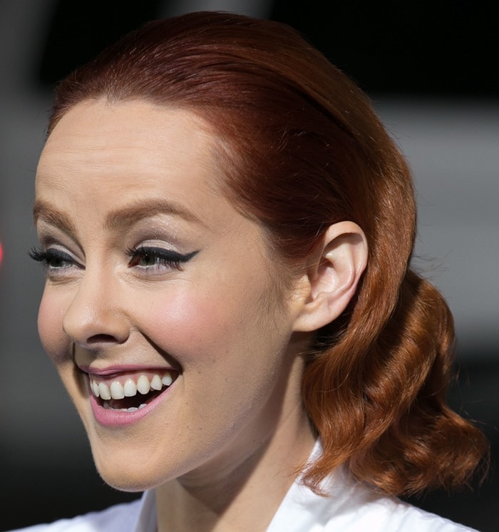 Jena Malone radiates vintage Hollywood charm with softly waved auburn hair and winged eyeliner at the Inherent Vice premiere