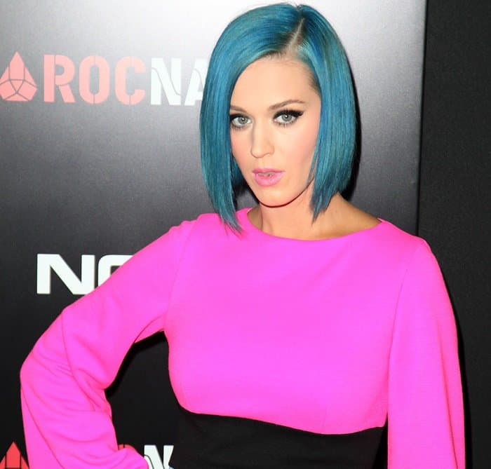 Katy Perry styled her look with a bold pink top and striking blue bob hairstyle at the Roc Nation Pre-Grammy Brunch