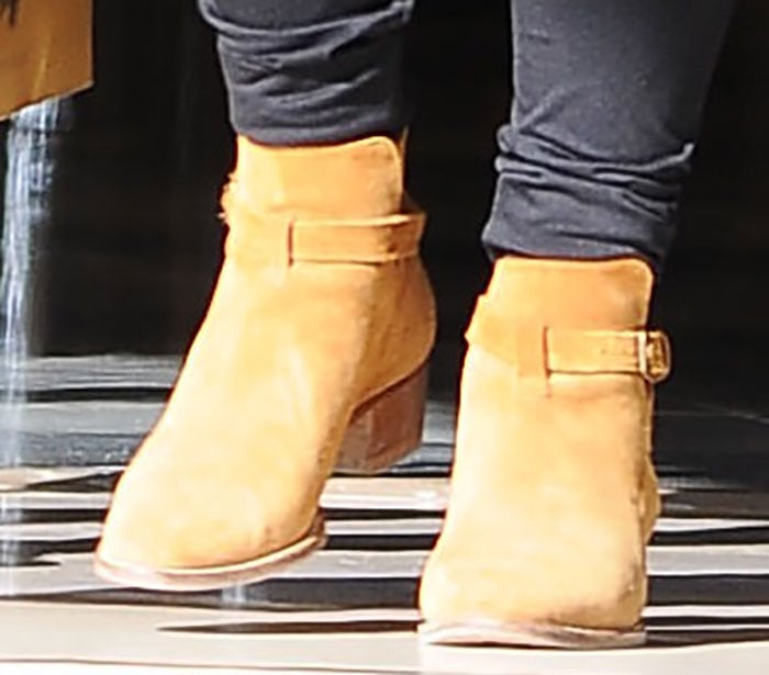 Kourtney Kardashian steps out in tan suede Saint Laurent ankle boots, effortlessly blending chic and casual style