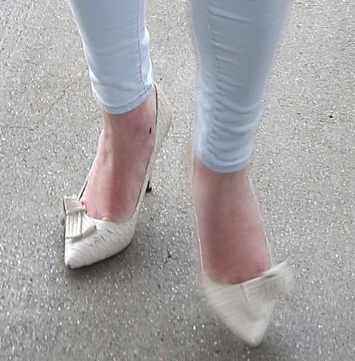 A closer look at Lindsay Lohan’s Isabel Marant Poppy heels reveals the elegant pointed-toe silhouette and feminine suede bow finish