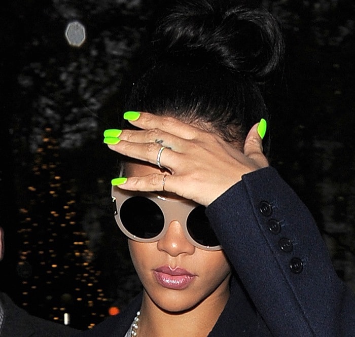 Rihanna's neon green manicure, Stella McCartney "Flat Cat Eye" sunglasses, and rings