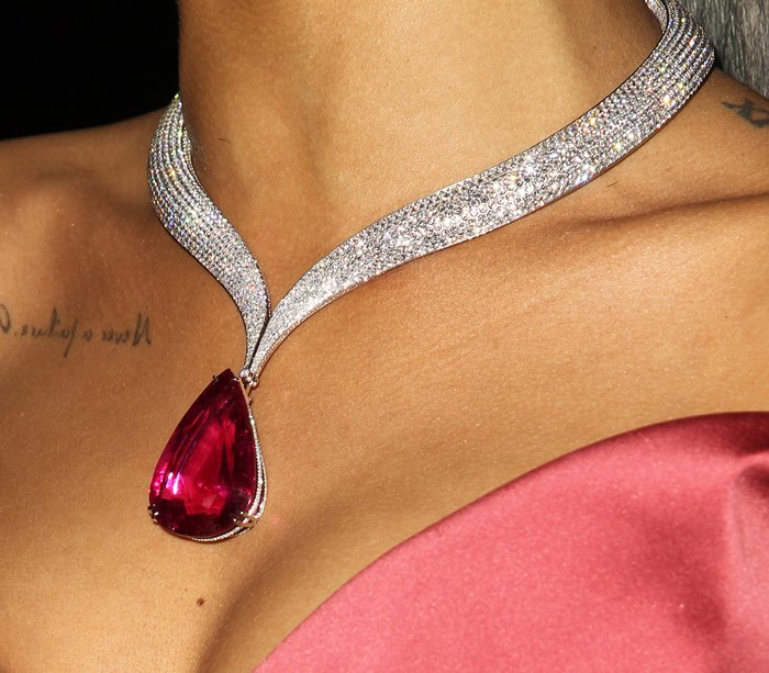 Rihanna's statement necklace features a stunning Chopard tourmaline-and-diamond design with a large, teardrop-shaped deep red tourmaline pendant