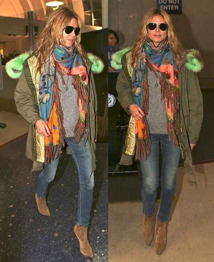 Heidi Klum wears jeans with Saint Laurent Paris heeled cowboy ankle boots
