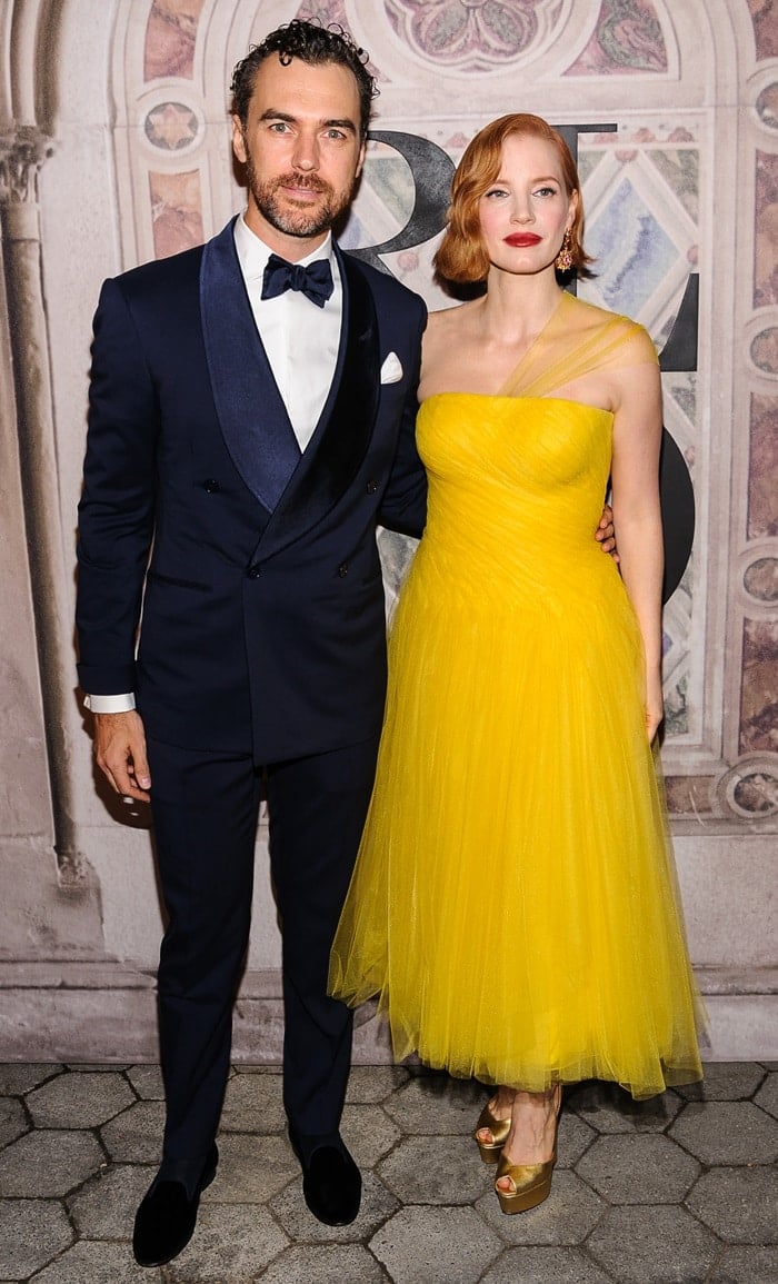 Jessica Chastain dazzled in a strapless bright yellow chiffon gown paired with gold platform heels, while Gian Luca Passi de Preposulo opted for a classic navy tuxedo at Ralph Lauren’s 50th Anniversary show during New York Fashion Week on September 7, 2018