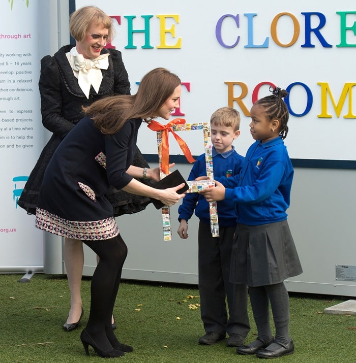 Kate Middleton greeting children at Barlby Primary School while showcasing her Madderson London Naomi maternity dress