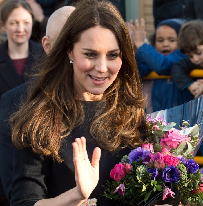 Kate Middleton wearing a pink-trimmed Madderson London shift dress while arriving at Barlby Primary School during her second pregnancy