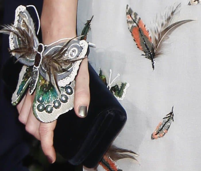 Close-up of Keira Knightley's custom Chanel butterfly-print gown, showcasing the intricate butterfly and feather details
