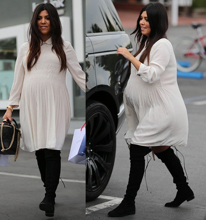 Kourtney Kardashian exudes vintage-chic style, pairing a flowy white dress with black over-the-knee boots during her pregnancy