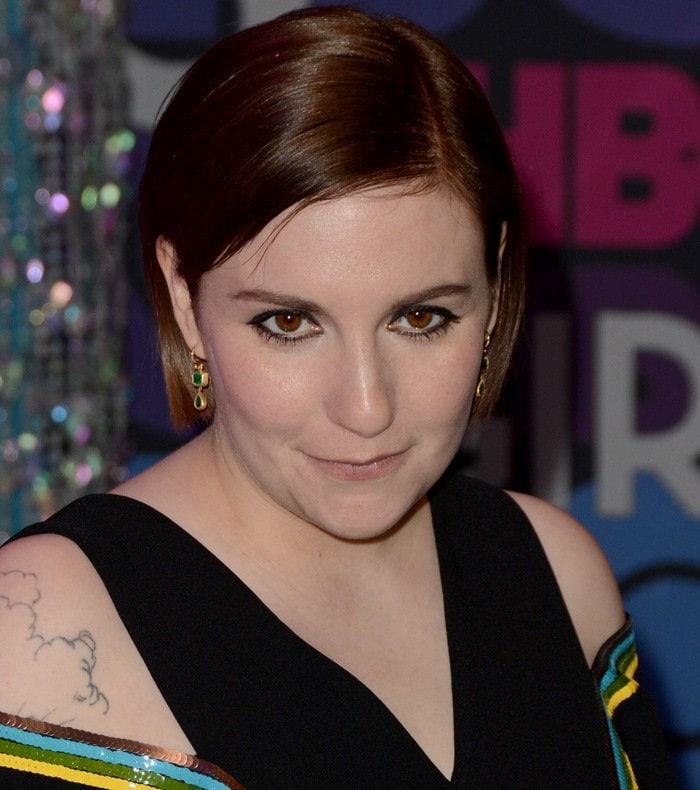 Lena Dunham keeps her beauty look understated with a sleek auburn bob, emerald drop earrings, and softly defined eyes at the season four premiere of Girls