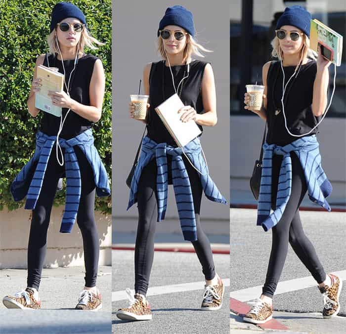 Emma Roberts gives leggings a street-style upgrade by pairing them with leopard-print sneakers, a tied flannel shirt, and a beanie for the ultimate casual-cool errand look
