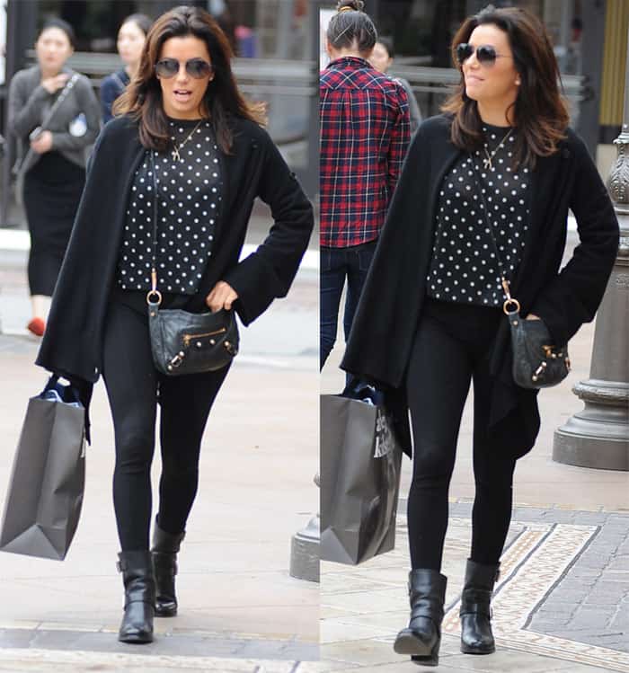 Eva Longoria nails polished casual by pairing black jeggings and Jimmy Choo ankle boots with a playful polka dot top and draped cardigan—perfect for a chic shopping day
