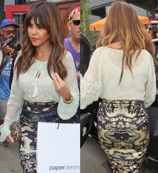 Kourtney Kardashian redefines chic at the Paper Denim Cloth and Baby2Baby Luncheon in Los Angeles, pairing a delicate lace peasant blouse with an ornate pencil skirt