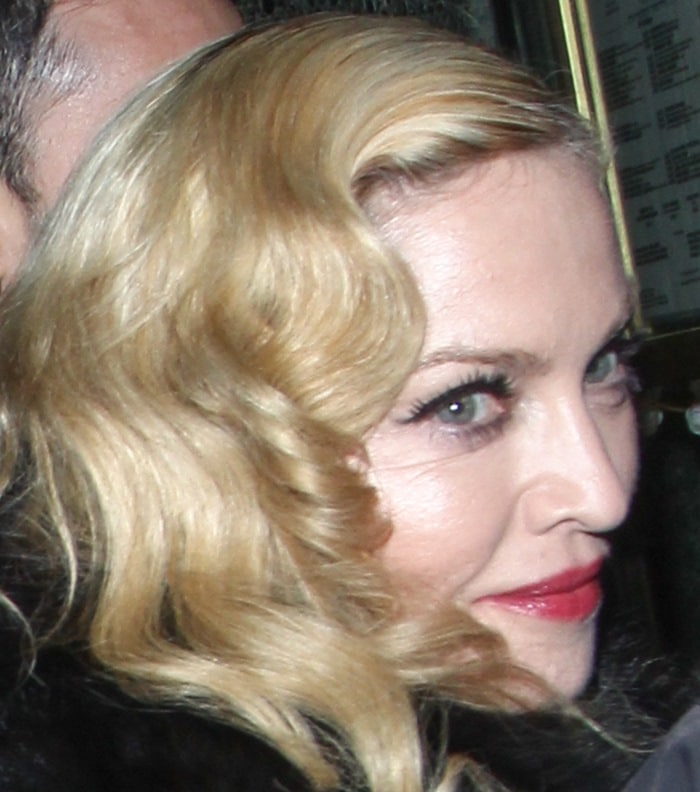 Madonna wears her blonde hair down as she attends her Mert Marcus House of Love Party