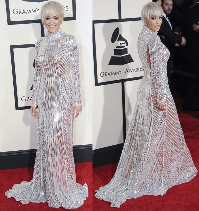Rita Ora dazzles in a shimmering, floor-length silver Prada gown with intricate embellishments and a semi-sheer design at the 2015 Grammy Awards