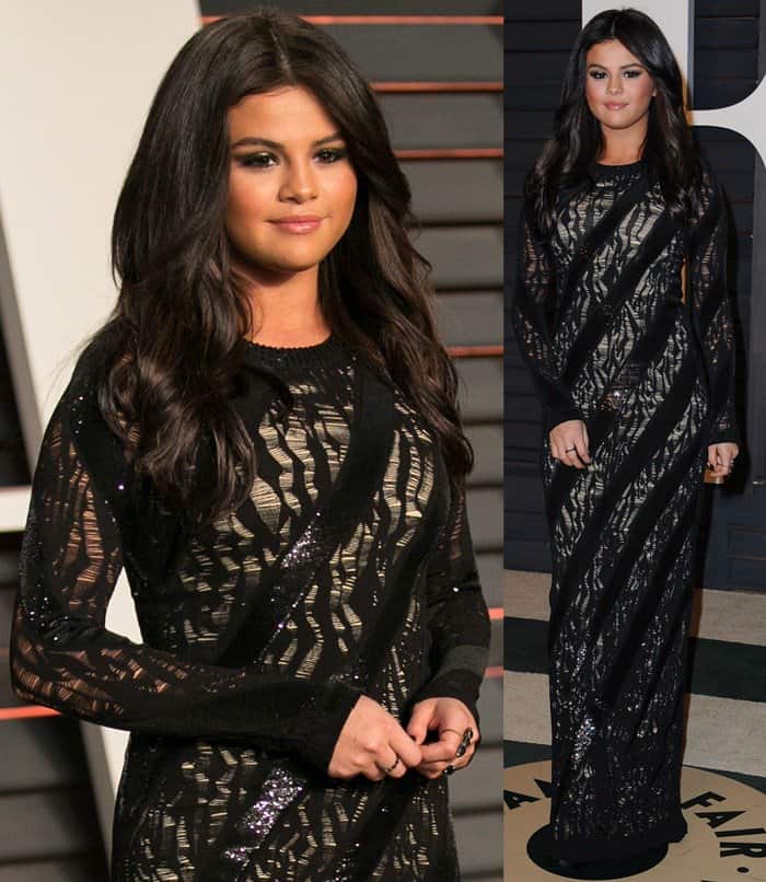 The singer stuns in a long-sleeved black Louis Vuitton gown with metallic stripes at the 2015 Vanity Fair Oscar Party, effortlessly combining sleek sophistication with youthful confidence