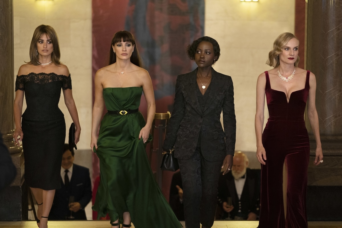 Penélope Cruz, Jessica Chastain, Lupita Nyong'o, and Diane Kruger make a striking entrance in The 355, exuding elegance and power in sophisticated eveningwear that blends high fashion with espionage intrigue