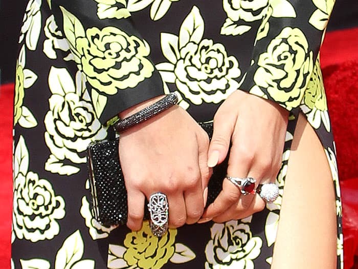 A selection of John Hardy rings and a black Swarovski clutch on Zendaya Coleman