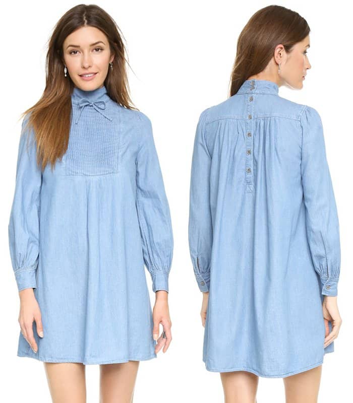 A softly structured chambray shift, the AG Alexa Chung x AG “Julie” dress features a pintucked front, high tie-neck collar, and long sleeves—designed to fall effortlessly while offering a versatile foundation for everything from boots to heels