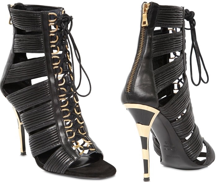 The Balmain 110 mm “Hopi” leather cage sandals — crafted in Italy with bold cutouts, gold hardware, and a sculptural stiletto heel