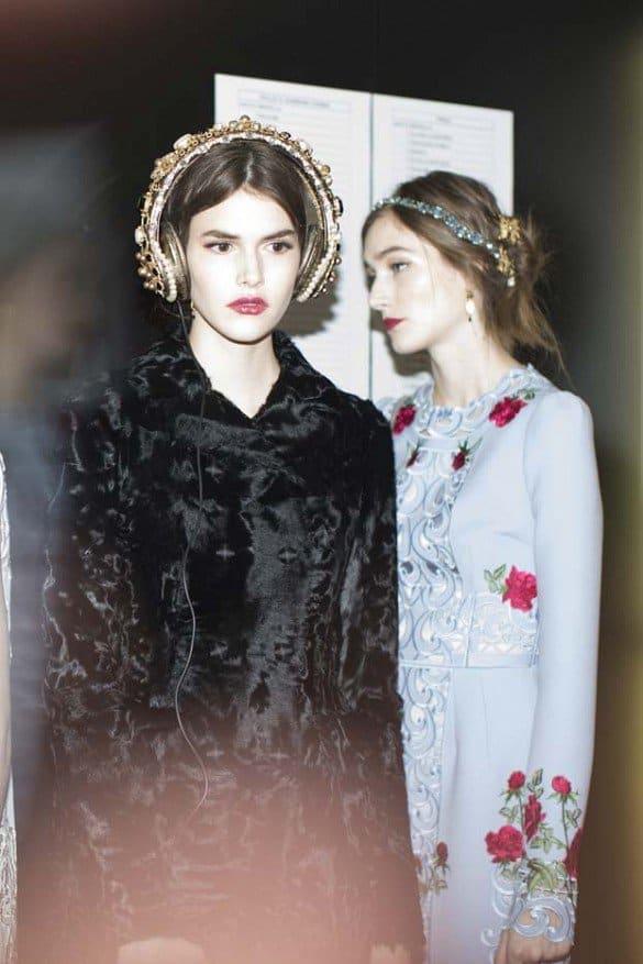 Dolce  Gabbana models showcase Swarovski crystal and pearl-embellished headphones with fur accents during the Fall 2015 show in Milan