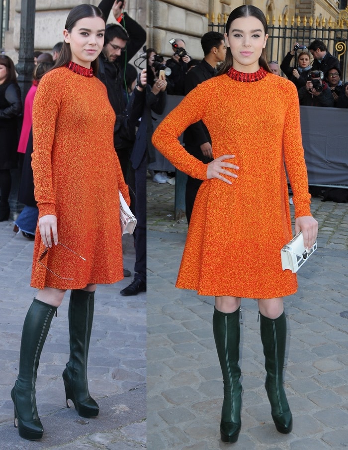 Hailee Steinfeld showcases her bright Dior knit dress styled with dramatic forest-green knee-high platform boots from the same collection