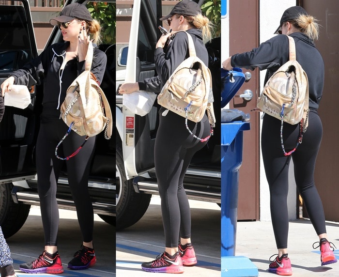 Khloé Kardashian sported black tight black work out gear and a tomboy cap