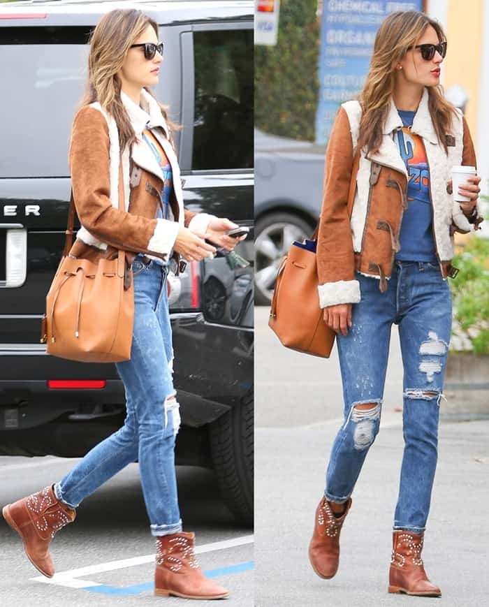 Alessandra Ambrosio embraces casual-chic style at Brentwood Country Mart on January 30, 2015, pairing a shearling jacket with ripped jeans, studded Isabel Marant boots, and a Mansur Gavriel bucket bag