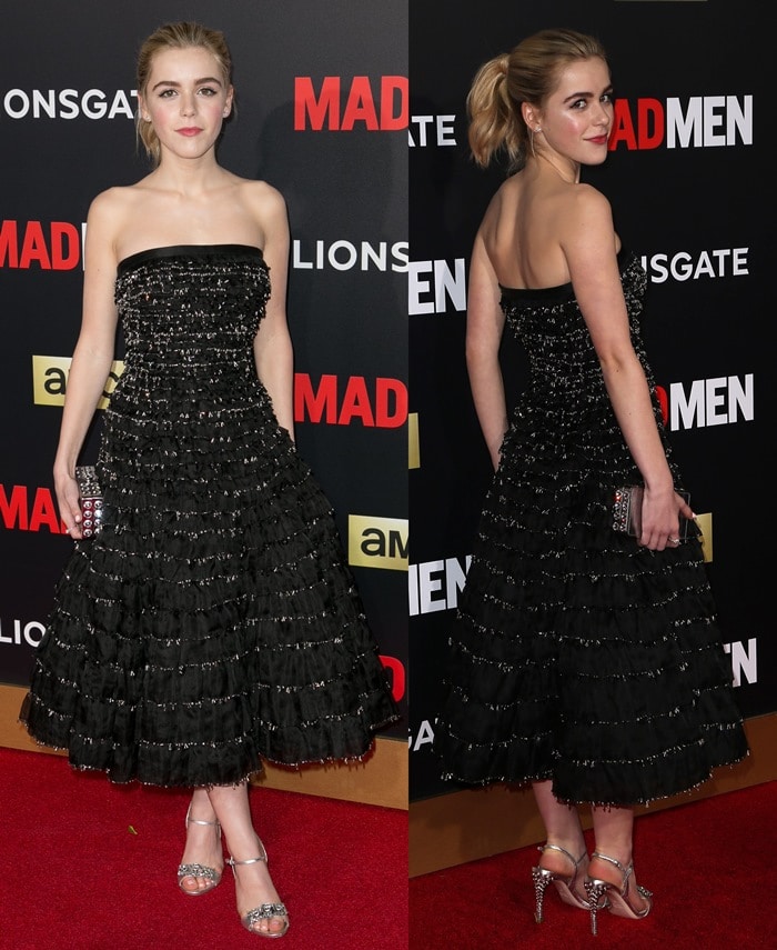 Kiernan Shipka arrives at the Mad Men Black Red Ball in a strapless black Miu Miu dress with tiered ruffles, finishing the look with metallic ankle-strap sandals
