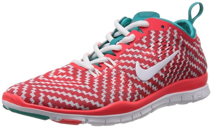This coral-and-teal zigzag colorway highlights the shoe’s dynamic Flywire support and multi-directional flex grooves designed for training versatility