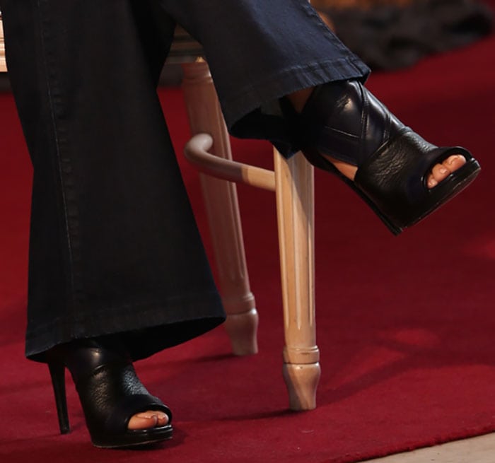 Salma Hayek completes her look with striking McQ by Alexander McQueen open-toe booties featuring quilted detailing and a sleek leather finish
