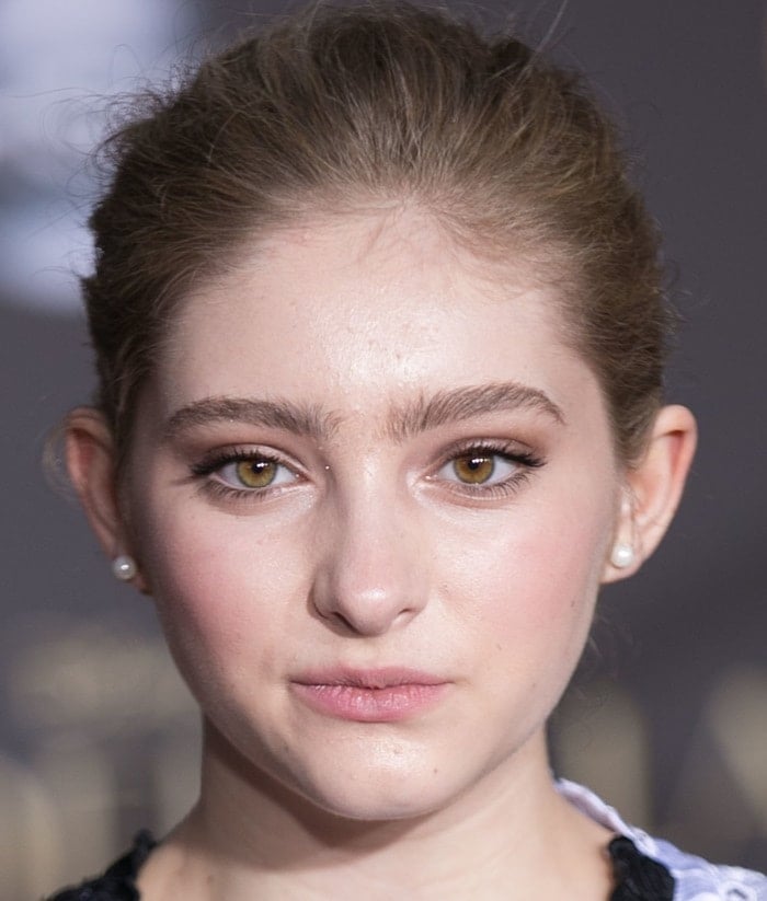 Willow Shields arrives at the Cinderella premiere with a polished beauty look, wearing her hair swept back to spotlight softly defined brows and luminous skin