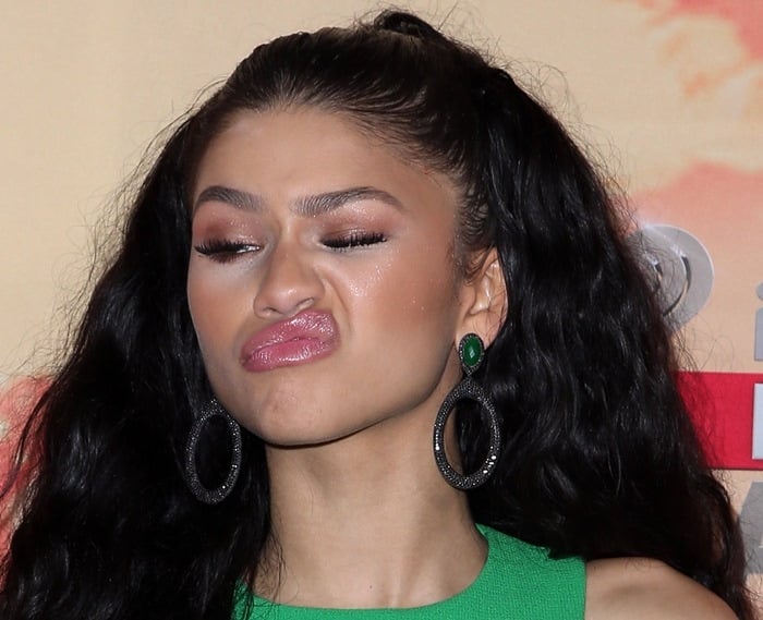 Zendaya keeps it playful on the red carpet while accessorizing with statement Carla Amorim and Pasquale Bruni jewelry