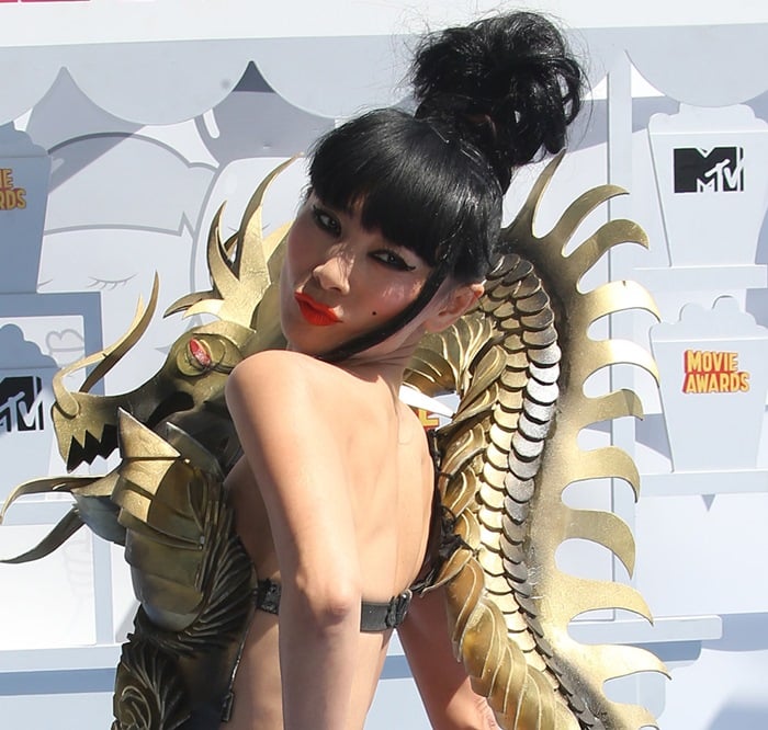 The dragon's sweeping tail curved down Bai Ling's bare back, revealing the intricate craftsmanship behind Rocky Gathercole's wearable-art creation