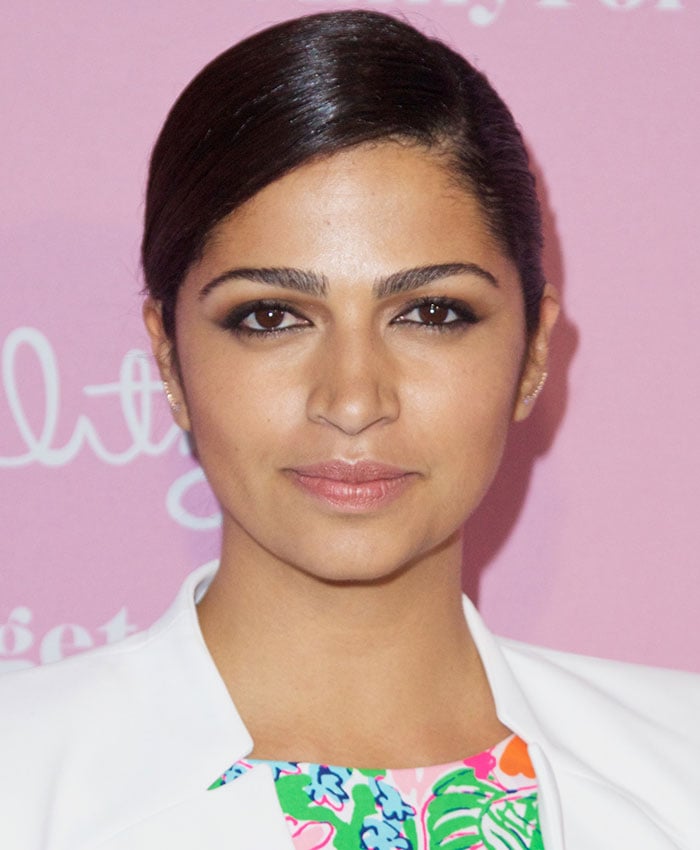 Camila Alves styled her hair into a sleek side-parted updo